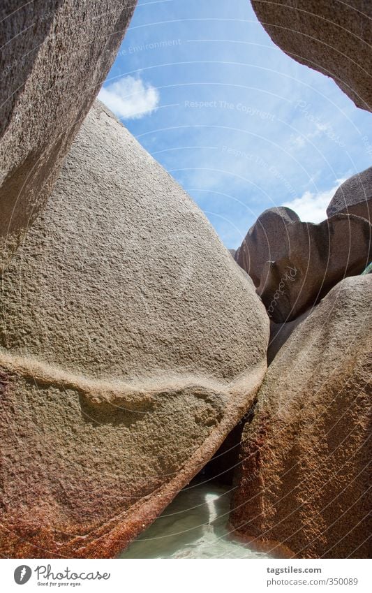 WATER, STONE, SHAPE Stone Rock Seychelles Swing Bow Ground down Beach Vacation & Travel Travel photography Tourism Relaxation Structures and shapes Blue sky