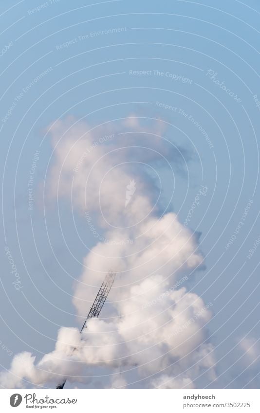 A single crane shrouded in smoke on a sunny day air architecture Background beautiful behind blue clear cloud clouds cloudy construction copy space design