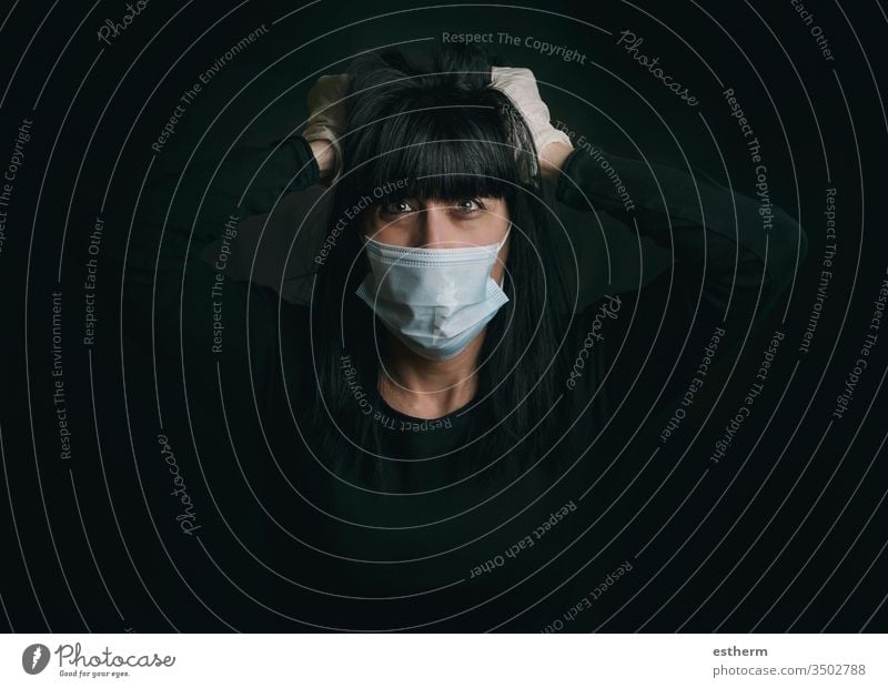 Coronavirus,young woman wearing medical mask desperate for the quarantine coronavirus covid-19 epidemic pandemic stay home furious stressed nervous despair