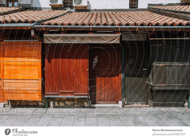 Empty street in old town, closed doors of small business owners due to coronavirus restriction no people abandoned architecture asia blue building bus station