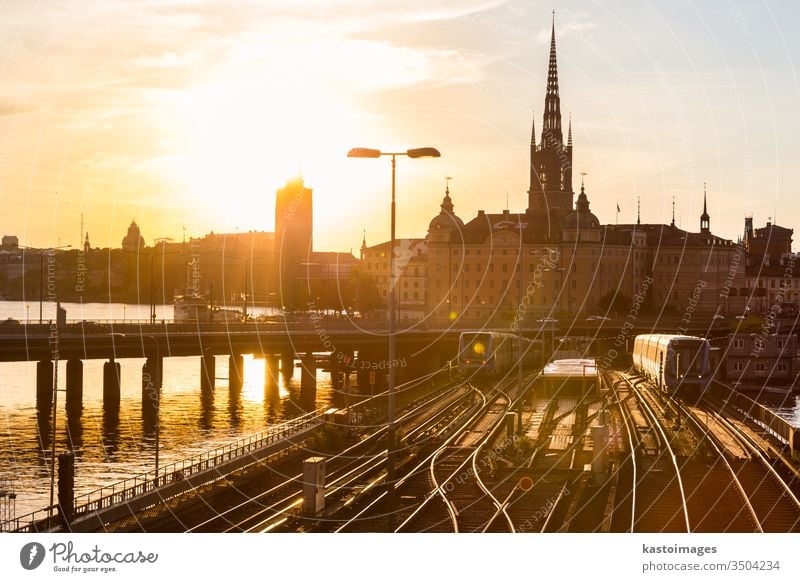 Railway tracks and trains in Stockholm, Sweden. railway railroad transport outdoor old travel tourism sweden europe town city skyline cityscape sunset