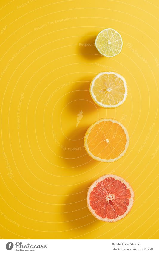 Cut citruses composition on lumber table half vitamin c line concept ripe assorted black colorful fruit fresh healthy organic natural juice lime lemon orange