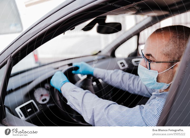 man driving a car wearing protective mask and gloves during pandemic coronacirus covid-19 coronavirus protective gloves infect automobile health transport air