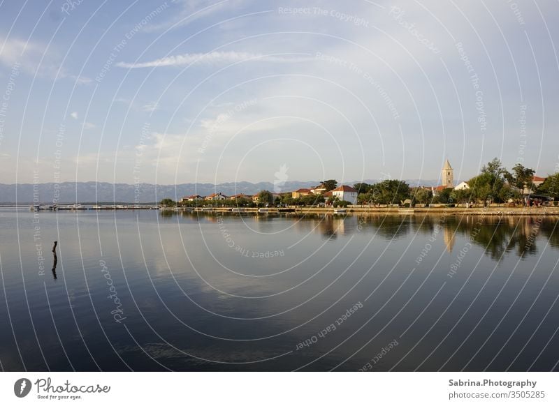 Irradiated island before mountains at sunset Mountain Ocean Croatia Island Beach Europe Eastern Europe Mediterranean sea Deserted Reflection