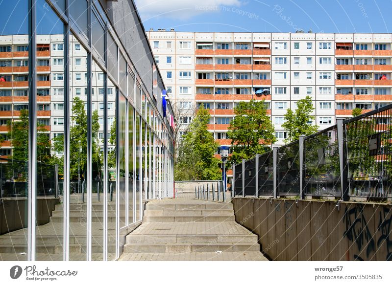 Magdeburger Plattenbau and its reflection in a glass facade Prefab construction Apartment Building Facade roadside Window Balconies reflections Glas facade off