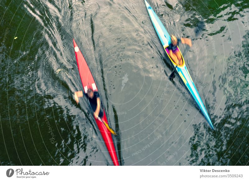 Two kayaks on the water with reflection background woman beach person sport fitness summer nature face sun active competition kayaking speed air fun lifestyle