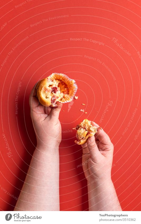 Eating a strawberry muffin. Woman hands holding a muffin. Fruit dessert 1 Quick bread muffins above view american bakery bitten breakfast cake colorful