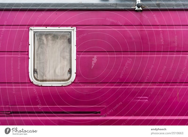 A window in a purple old camper alternative around the world Background backgrounds camping campsite caravan closed color colored copy space curtain day design