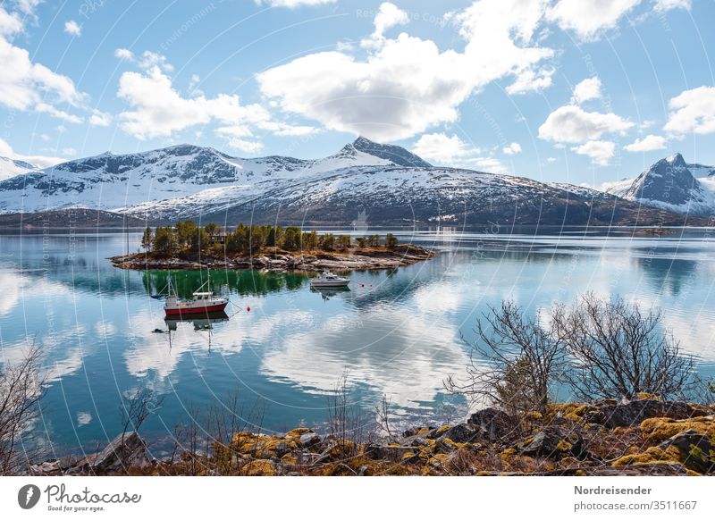 Landscape with island and fishing boat on the Lofoten in spring Island Coast Lofotes Ocean Water Fishing boat Fjord Rock Snow archipelago Norway ocean Moody