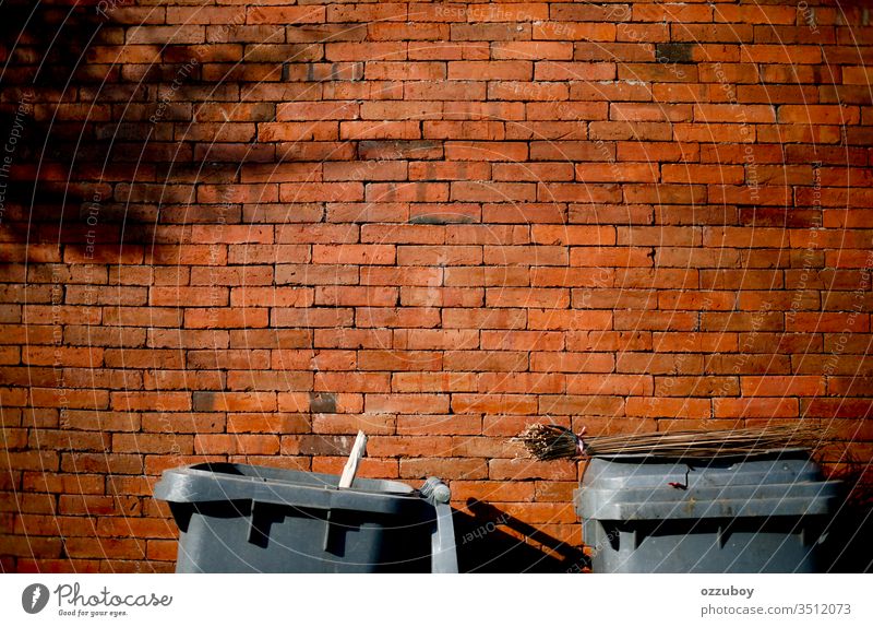 close up garbage bin with copy space Wall (building) Brick Brick wall Copy Space Yellow Red Garbage dump garbage can Trash container Shadow simplicity