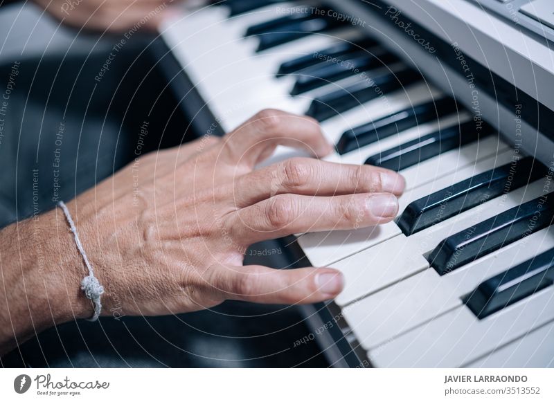 Hands playing a midi keyboard in a music studio hands musician artist audio digital composer entertainment guitar guitarist hobby instrument listening live