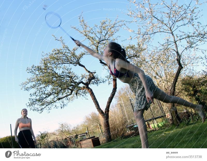 Badminton in the garden Shuttlecock Playing Leisure and hobbies Ball sports Fitness Colour photo Exterior shot Sports Joy Summer Day White Light Sports Training