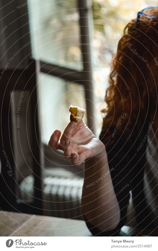 Woman eating a piece of cake woman hand ginger head bread Food photograph people curly hairs natural light indoor Cake Delicious Baked goods Dessert