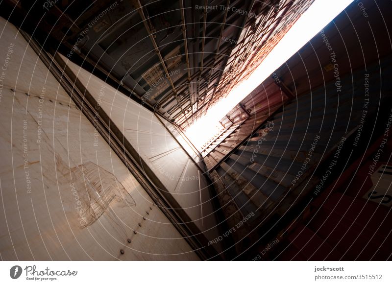 Storage between containers Wide angle Worm's-eye view Back-light Container terminal Stack Vertical Skyward Center point Orderliness Tall Sharp-edged Logistics