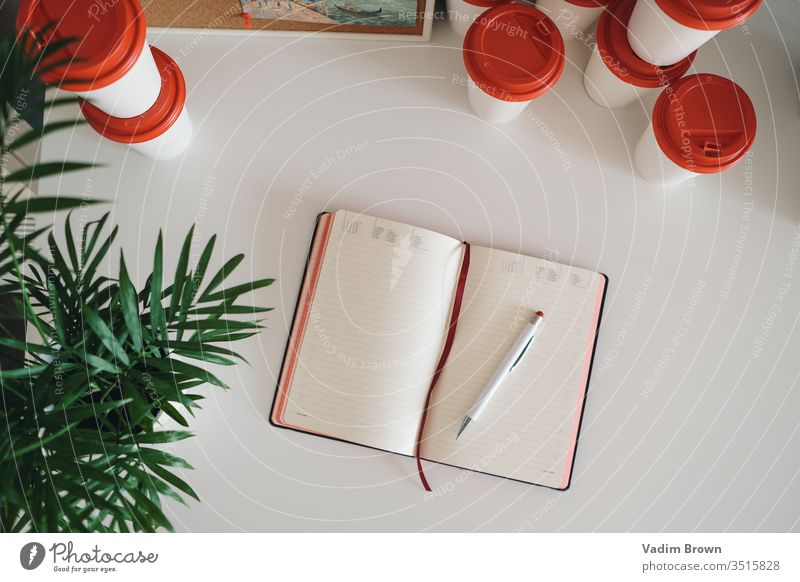 coffee cups and notebook pen work table with notebook Table Pen Coffee Work and employment Business Notebook Office White Blank Pencil Write Diary Block