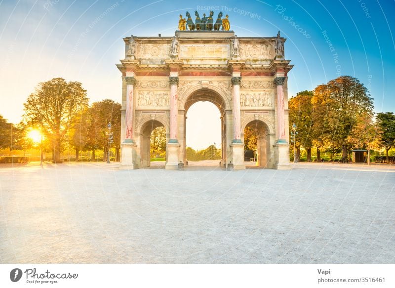 Paris Arc de Triomphe at the Place du Carrousel at sunset with no people during corona virus quarantine. Paris, France paris triomphe arc carrousel entrance