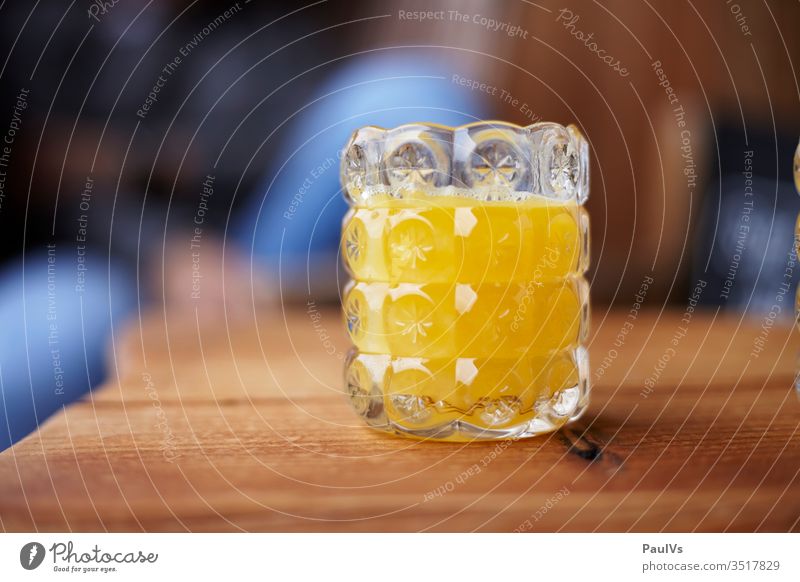 Orange juice in a glass at the wooden table Juice Wooden table Breakfast vitamins smoothie Self-made foodie Vitamin C salubriously Healthy Juices Fruity