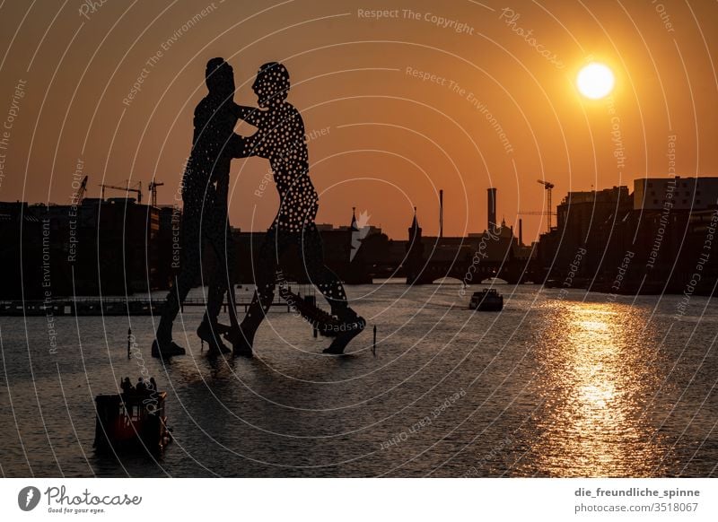 Molecule Men in the evening Sunset Spree Oberbaumbrücke Berlin Exterior shot Capital city bridge Landmark Tourist Attraction Town Water Kreuzberg Friedrichshain