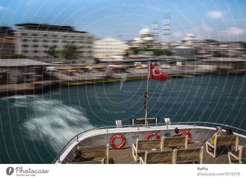 The Istanbul ferry is starting to pick up speed. urban Town The Bosphorus Lake ship Harbour Launch Ferry Home country home port seafaring technique Steel Tug