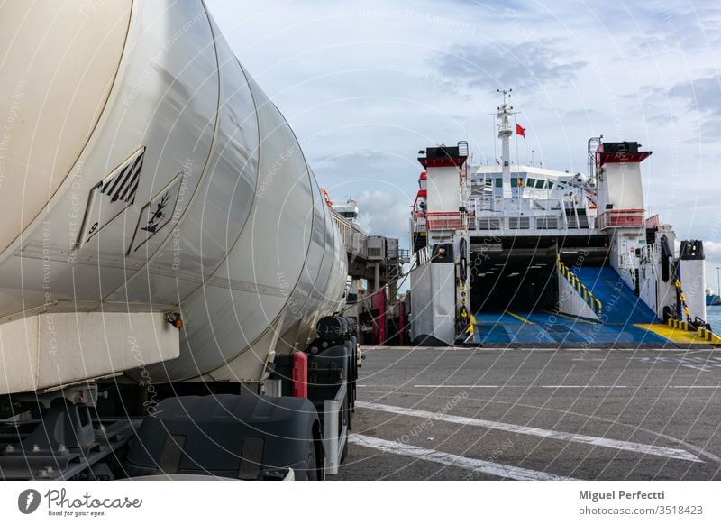 Tank truck in the port tank truck danger danger goods signs danger plates danger sign dangerous dangerous freight dangerous goods dock liquid transport