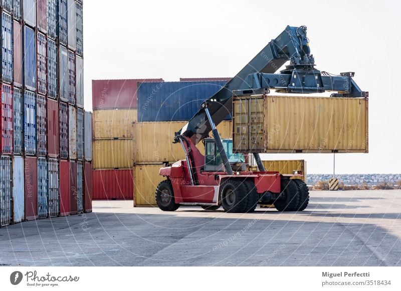 Harbor crane horizontal storage port worker logistic job commercial import export ship loaded dockside unloading international delivery forklift terminal heavy