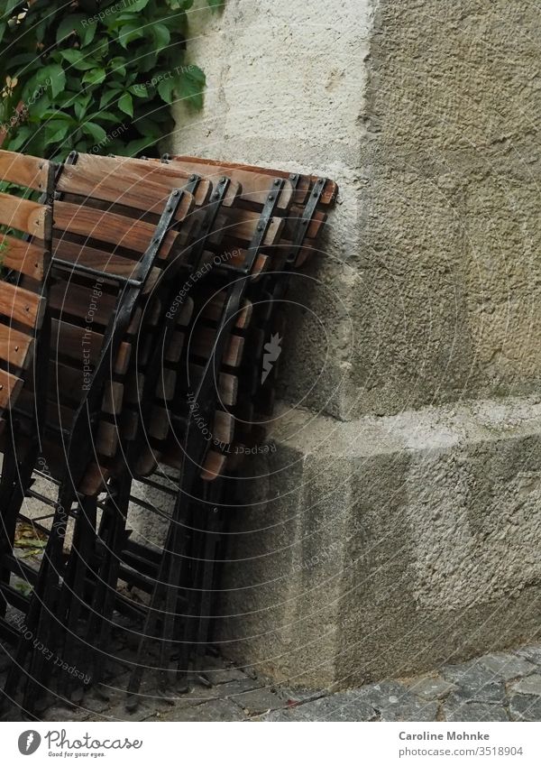 Bistro chairs in a row at the corner of the house house wall house corner Facade Café garden café Closed loosening Stone Restaurant Gastronomy blocking corona