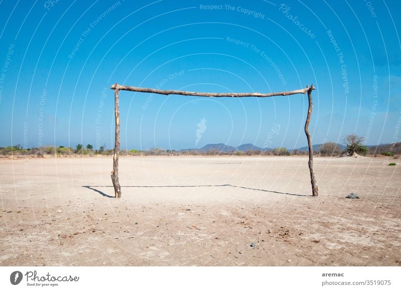 Homemade football goal on a clay court in Africa soccer Soccer Goal Football pitch Sports Sand Zimbabwe game Deserted Ball sports Sporting Complex