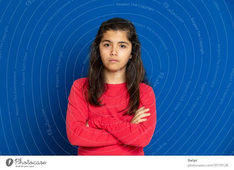 Preteen girl with red t-shirt preteen blue scared surprised horrified emotion gesture worried excited problem portrait expression female people person pretty