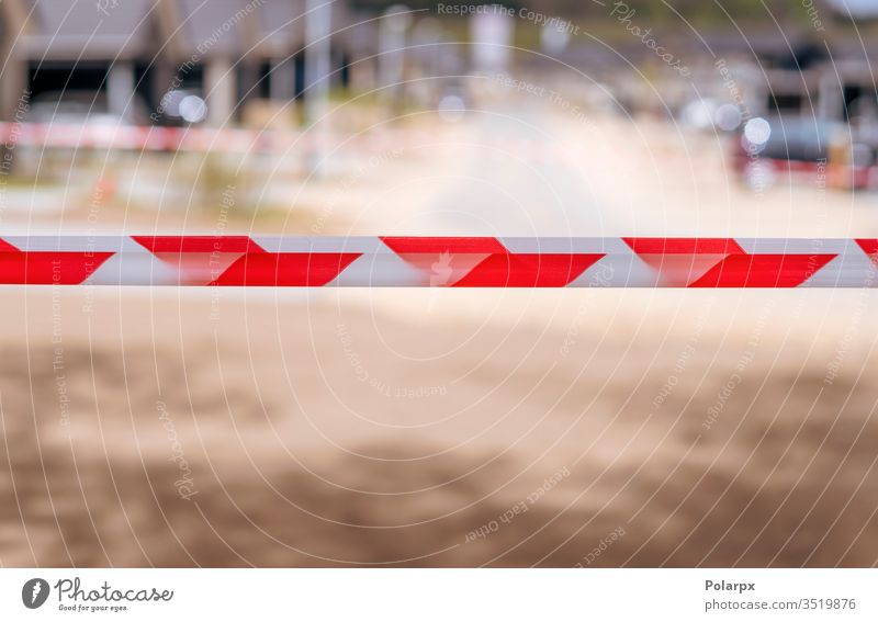 Restricted area with tape at a neighborhood red line concept control attention park closed prevent background danger contagious alert closure prevention