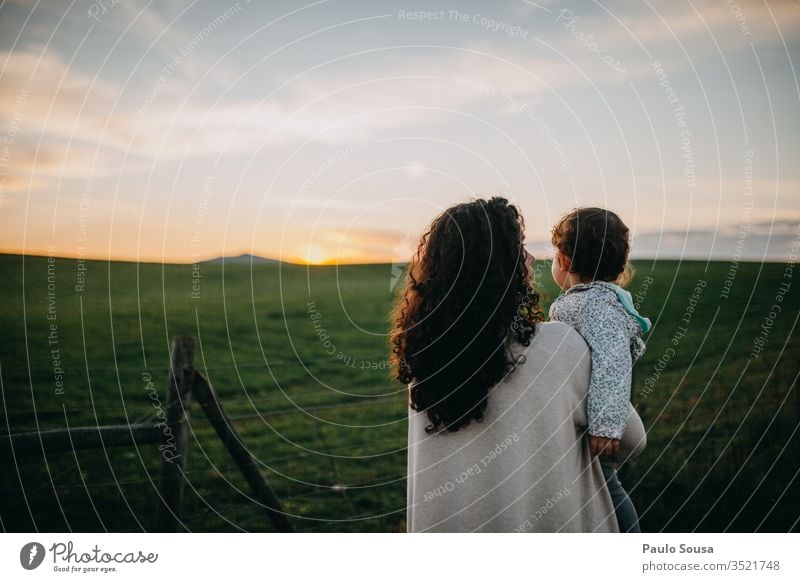 Mother and Daughter watching sunset Sunset sunset sky motherhood Child Together togetherness Family & Relations Adults Joy Love Happy Lifestyle Parents Infancy