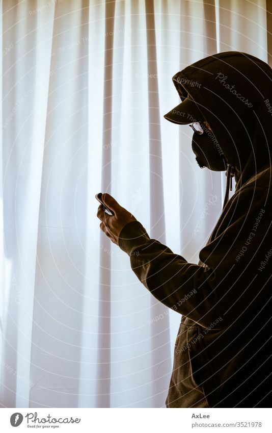 Hand of a man looking through window young silhouette person people portrait one hat beautiful phone black white face shadow business beauty criminal home