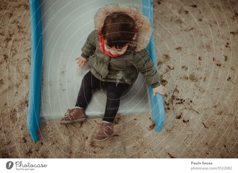 Child having fun on slide Playground Park Slide Joy childhood play happy little kid cute happiness lifestyle portrait caucasian people joy funny