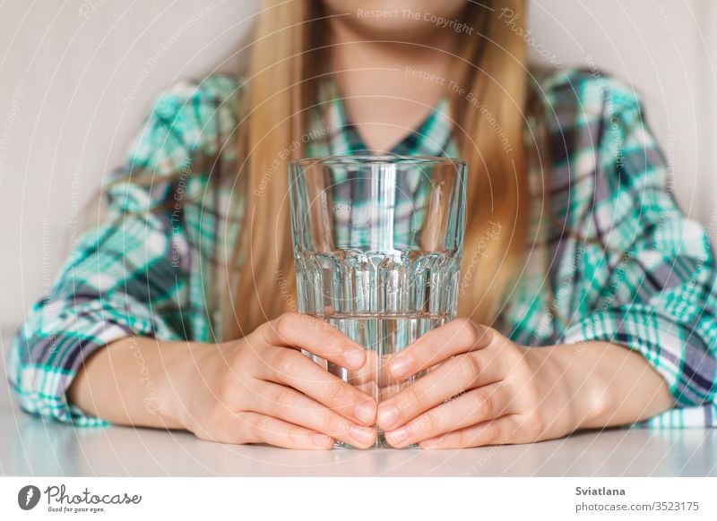 Hands of a girl close up, holding a glass of pure water white hand female drink clean healthy isolated adult care food give keep background fresh empty break