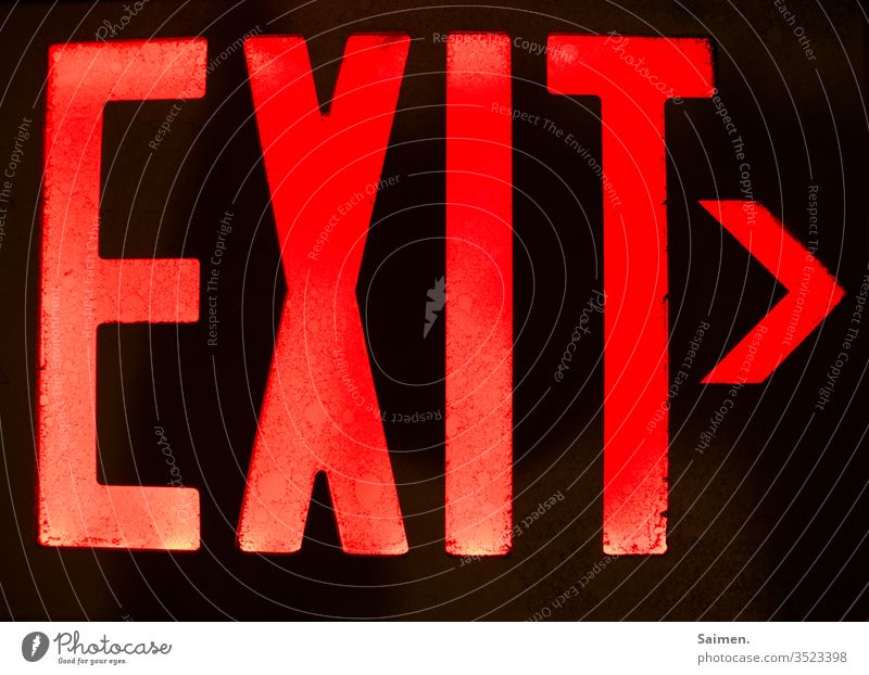 exit sign Way out Direction Road marking Highway ramp (exit) English ring illuminated sign Light Emergency exit Signs and labeling Colour photo Escape route