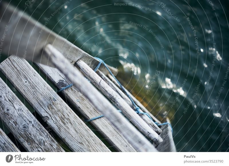 ladder into the blue water / into the lake / Mondsee / jetty Austria moon lake Footbridge Wet cooling vacation Holiday at home Freshwater wood Weathered Ladder