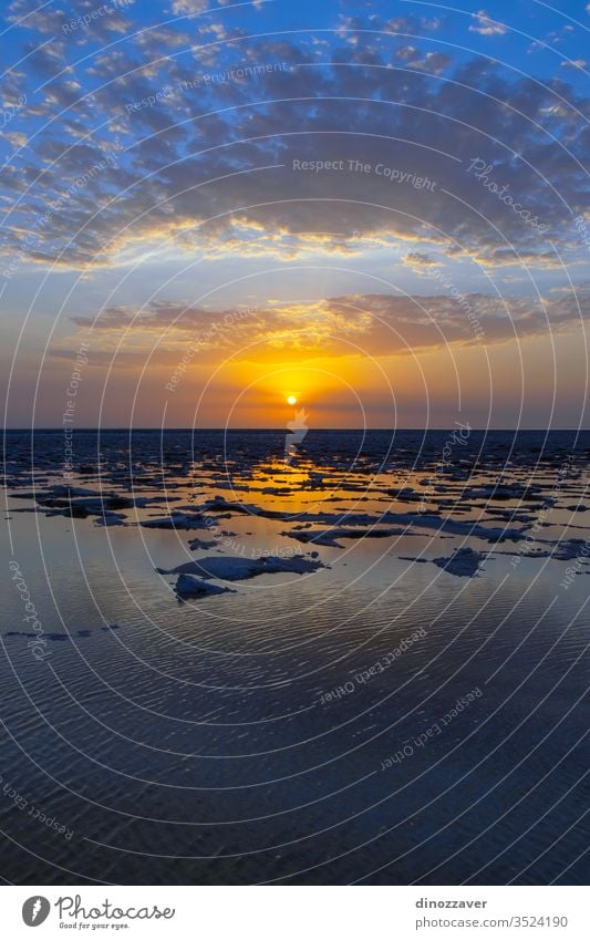 Danakil desert sunset with salt flats, Ethiopia danakil mining lake water dallol ethiopia tranquil scenic nature africa african sky landscape rock dry