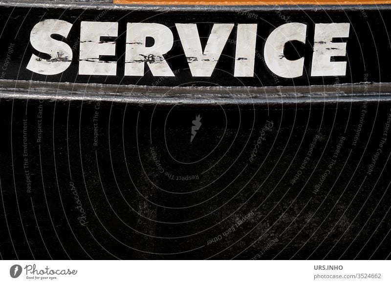 white lettering SERVICE in capital letters on black background service Text Inscription Schriftzechen Black White Hull boat schmutziz Letters (alphabet)