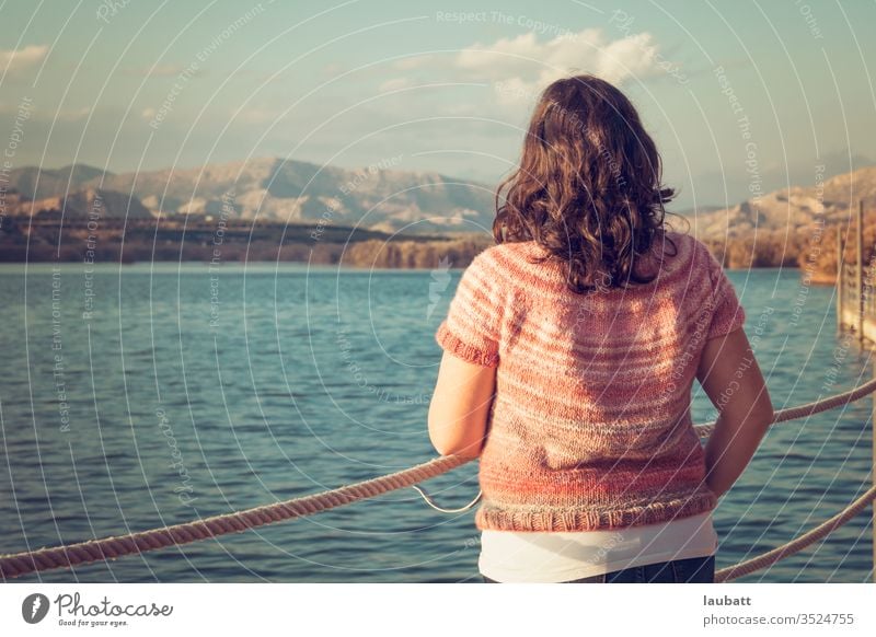 Woman staring at the lake side, back portrait of a woman looking to the horizon at the dock Lake Lakeside Day Exterior shot Nature Landscape Water Reflection