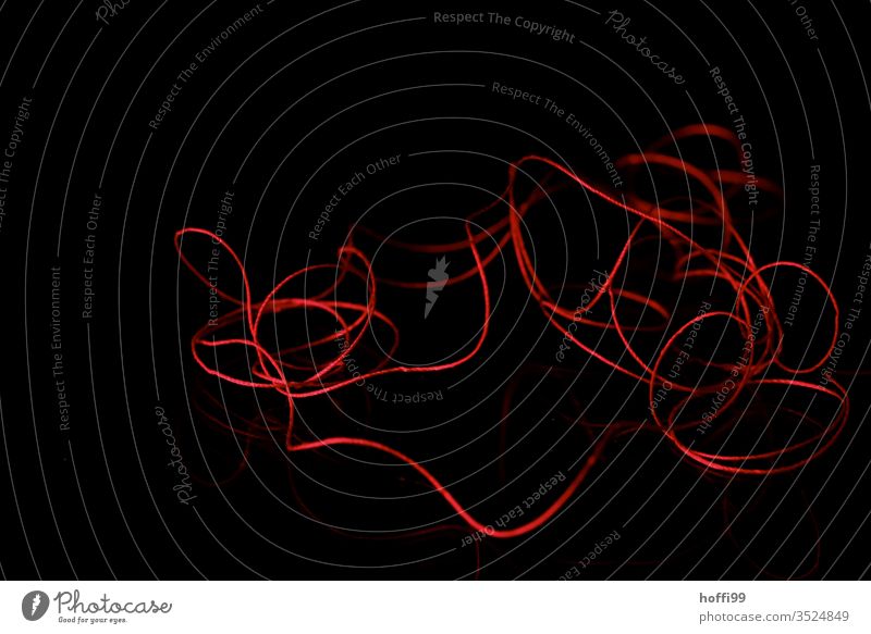 red thread on black background Red common thread twine yarn Loops Sewing thread Lose the thread Handbook String Curve Macro (Extreme close-up) Handcrafts