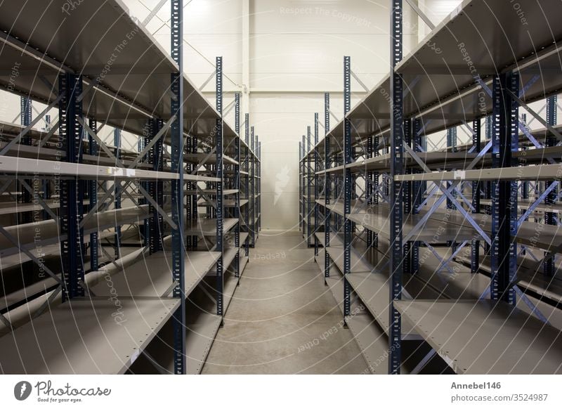 huge warehouse with empty racks inside for storage modern design, metal shelves for distribution storehouse industry business shelf new industrial interior