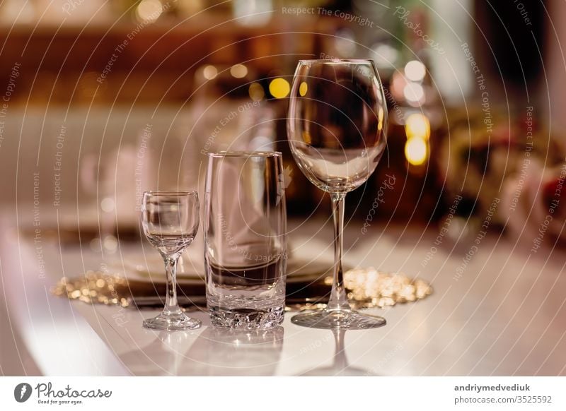 Serving on the table. Crystal glasses. Wedding. Banquet. banquet decoration restaurant cafe cutlery dining dinner drink elegant interior lunch luxury napkin