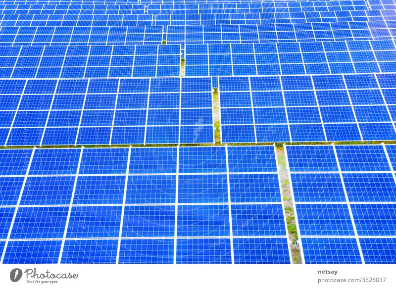 power solar panel on blue sky background,alternative clean green energy concept. Aerial view of Solar panels Photovoltaic systems industrial landscape light