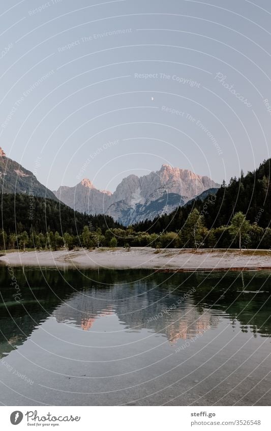 Lake with mountain panorama and reflection in Slovenia Triglav National Park triglav Reflection in the water Water mountain lake Panorama (View) Evening Dusk