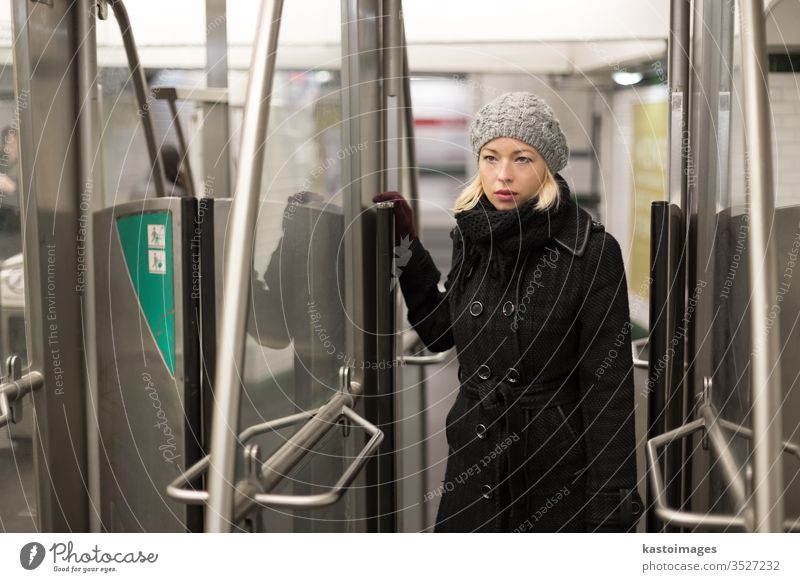 Woman on subway. woman transport public transportation underground metro train urban young travel daily routine ticket pass exit entrance person female city