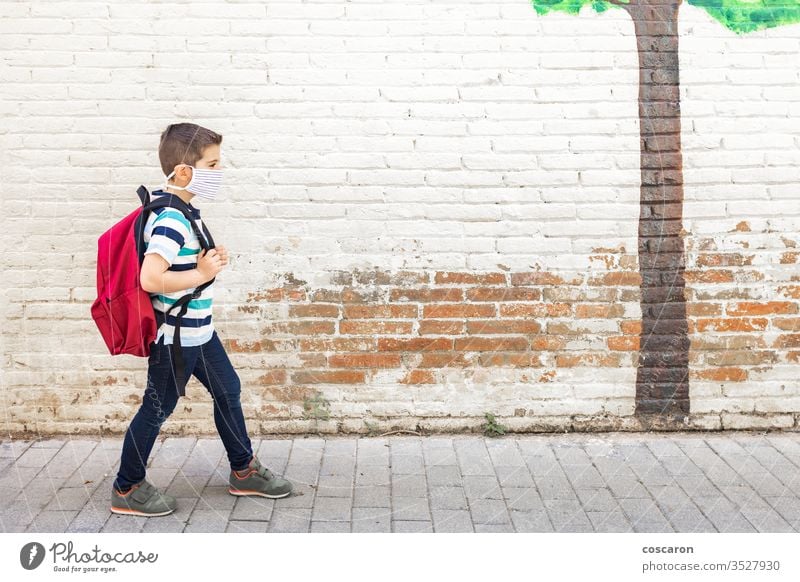 Little boy going to school with protective mask back to school backpack care child childhood city class closed college corona corona virus coronavirus covid-19