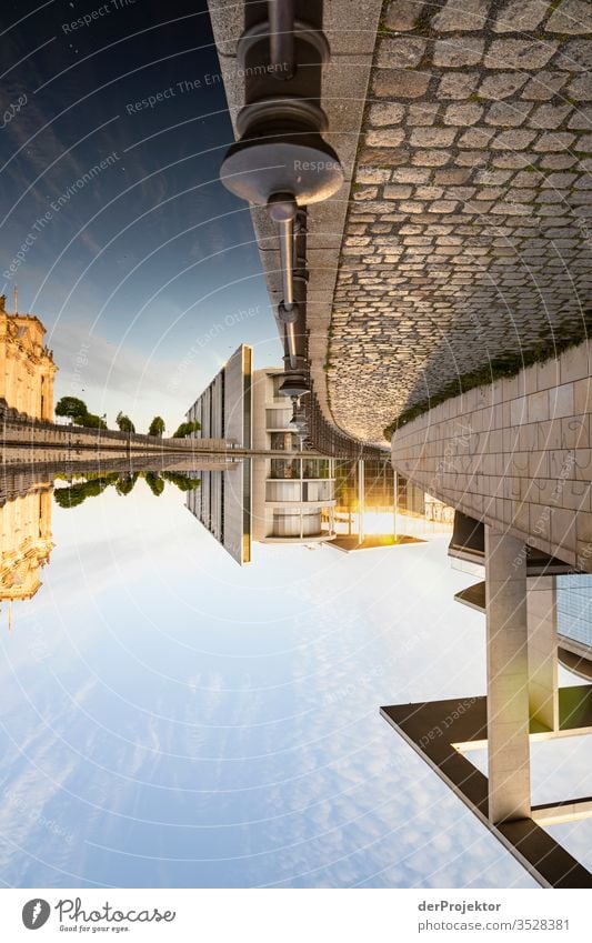 The world stands still and upside down in the government quarter in Berlin Long shot Central perspective Deep depth of field Sunbeam Sunlight Reflection