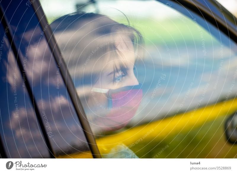 Girl with mouth guard waiting in car girl Mask Meditative Respirator mask Car Face mask Town Youth (Young adults) Wait Virus coronavirus anxious viruses