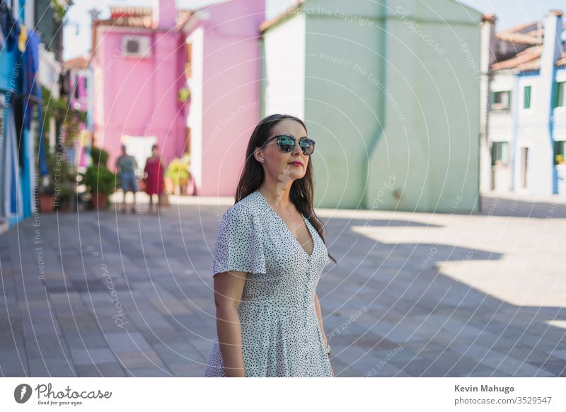 Beautiful woman on Venice, Italy street yellow pink wall colourful building colours scenery country blue european beautiful front house grey home scenic paint