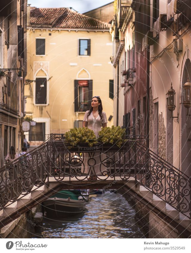 Beautiful woman looking at the canals of Venice, Italy Woman Stone houses colors respiration travel youthful girl Style people Wall (building) Tavern person