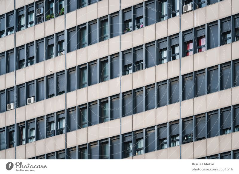 Rows of windows on the facade of a residential building shutters rows architecture outdoor outdoors exterior color architectural architectonic urban